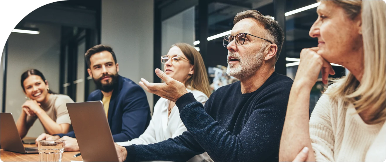 Business team discussing access control policies in a conference room, representing enterprise authorization management and security strategy.