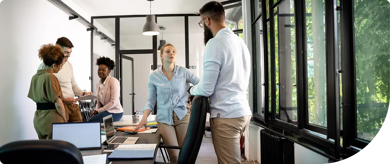 Work team colleagues collaborating in an office boardroom