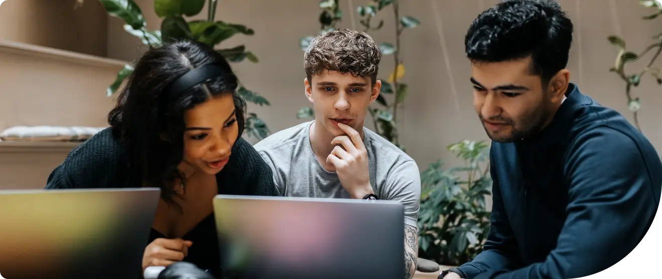 Collaborative team of workers reviewing IAM compliance reports with Duo Identity Security Tools.