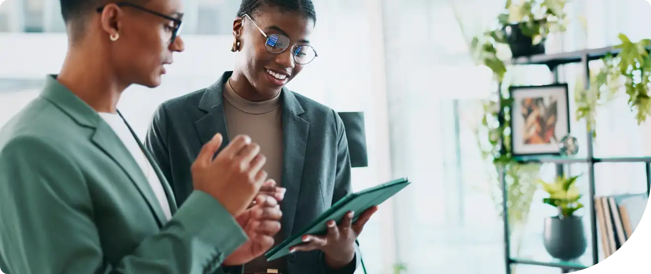 Two IT Tech Support Remote workers looking through Duo's Incident Management Policy after a cybersecurity incident.