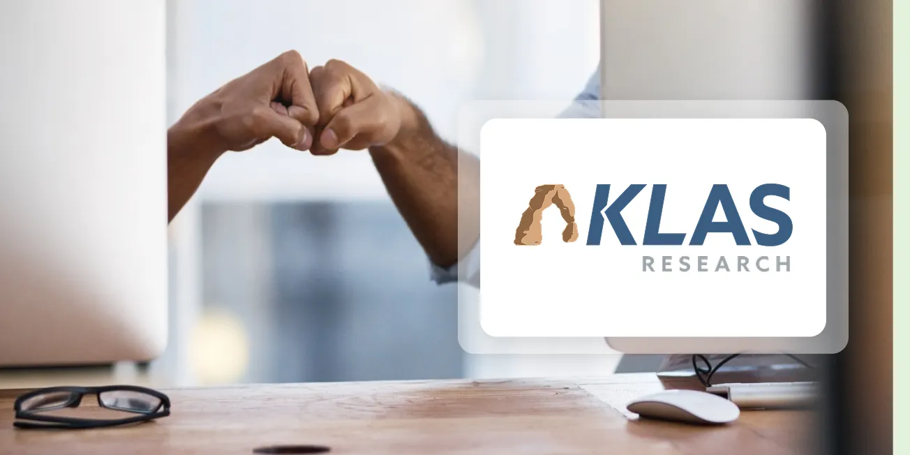 Duo celebrates the Best in KLAS award for the Access Management Category. Two employees are clasping their hands behind the KLAS award logo.