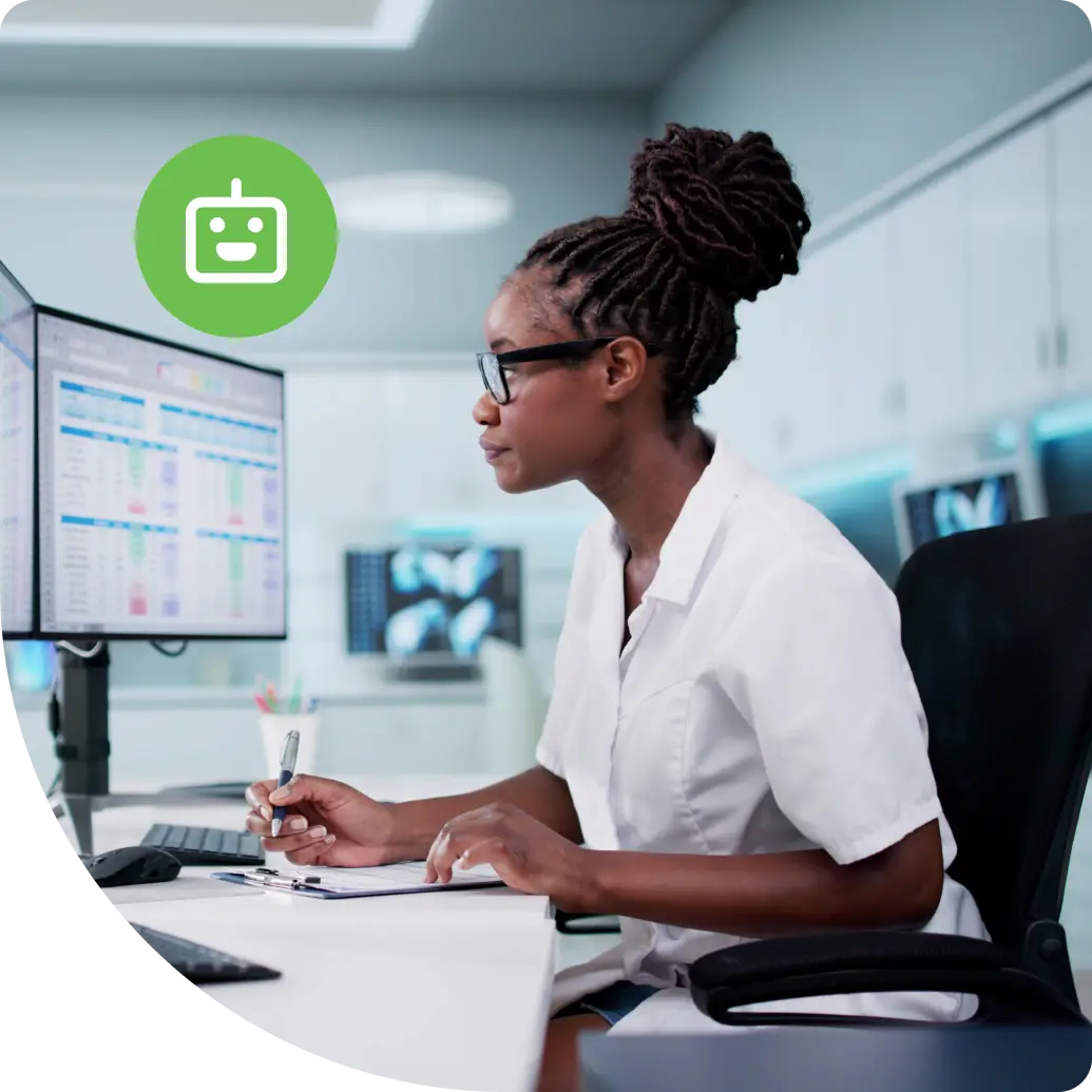 Security analyst monitoring agentic AI threat data across dual screens in a modern operations center, reviewing access patterns and anomalies