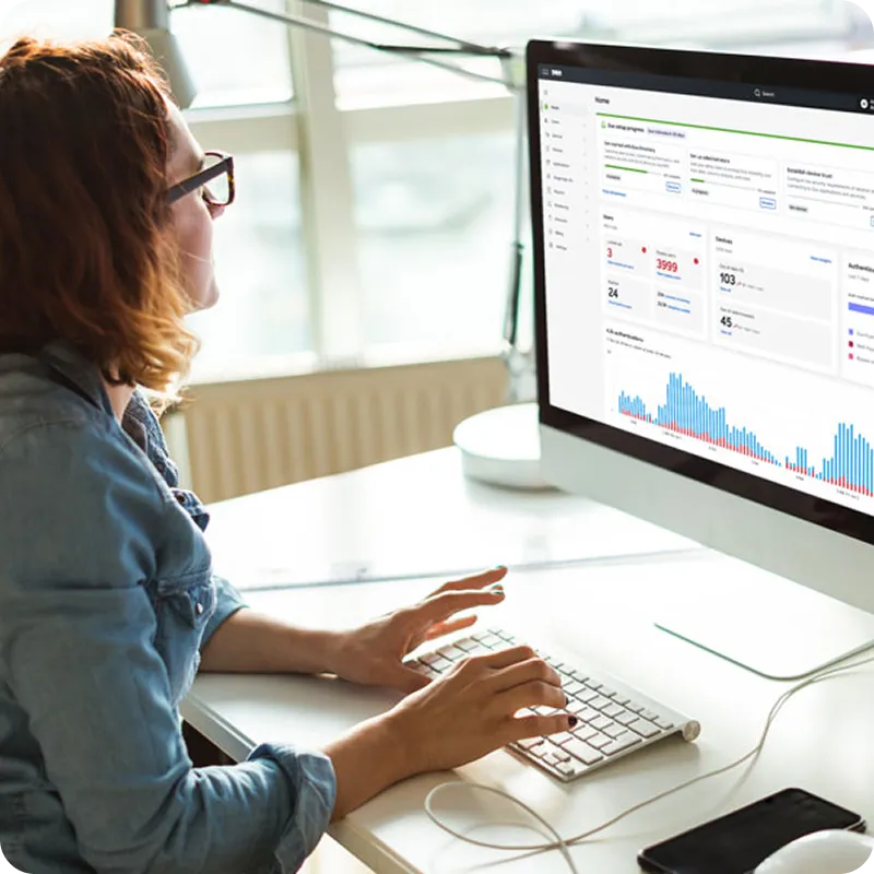 A chief information security officer (CISO) sitting infront of computer.