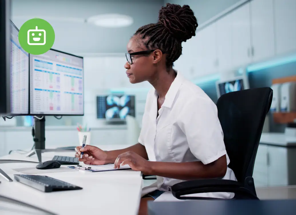 Security analyst monitoring agentic AI threat data across dual screens in a modern operations center, reviewing access patterns and anomalies